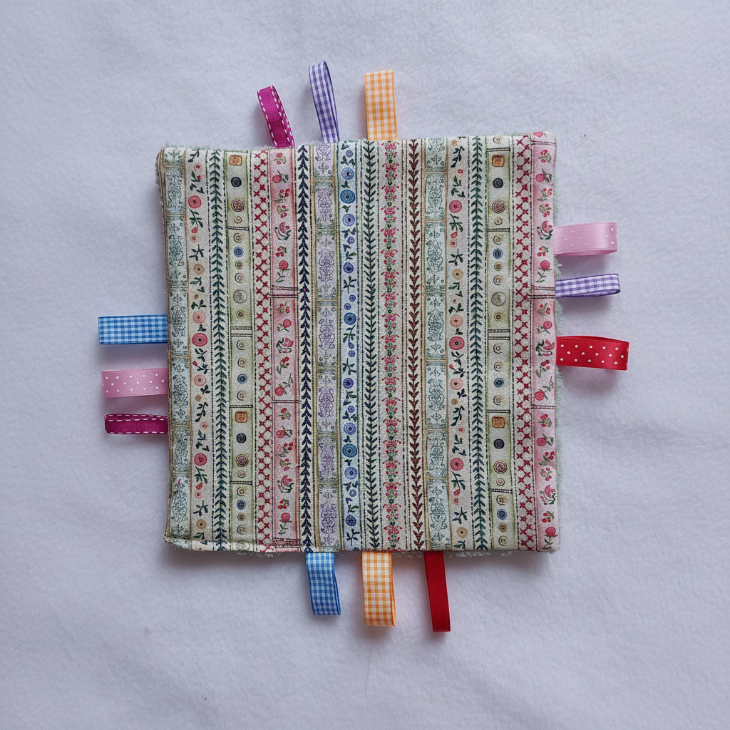 Knisperdoekje met kleurige lintjes print - Baby 0-3 jaar